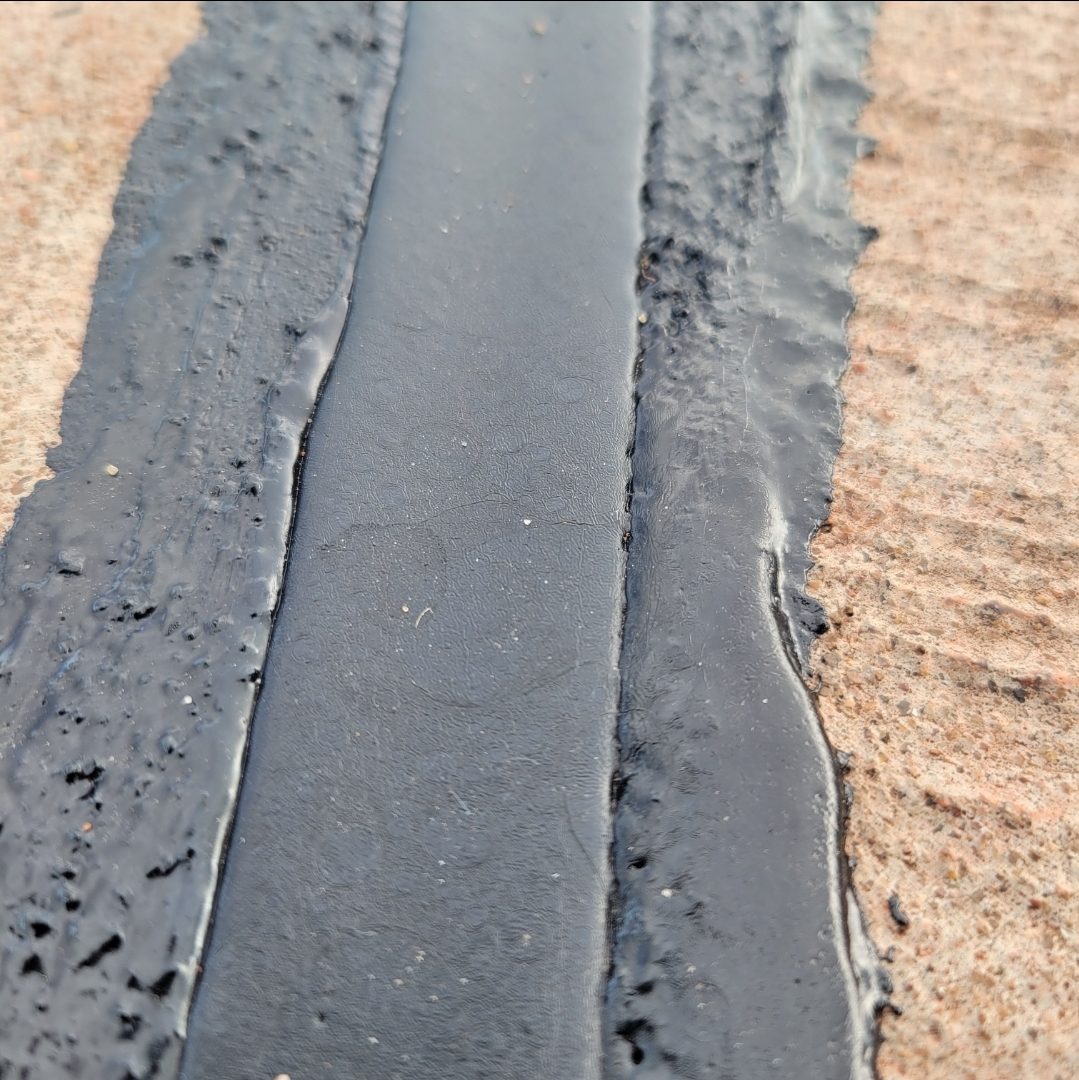 Hot rubber crack seal after application